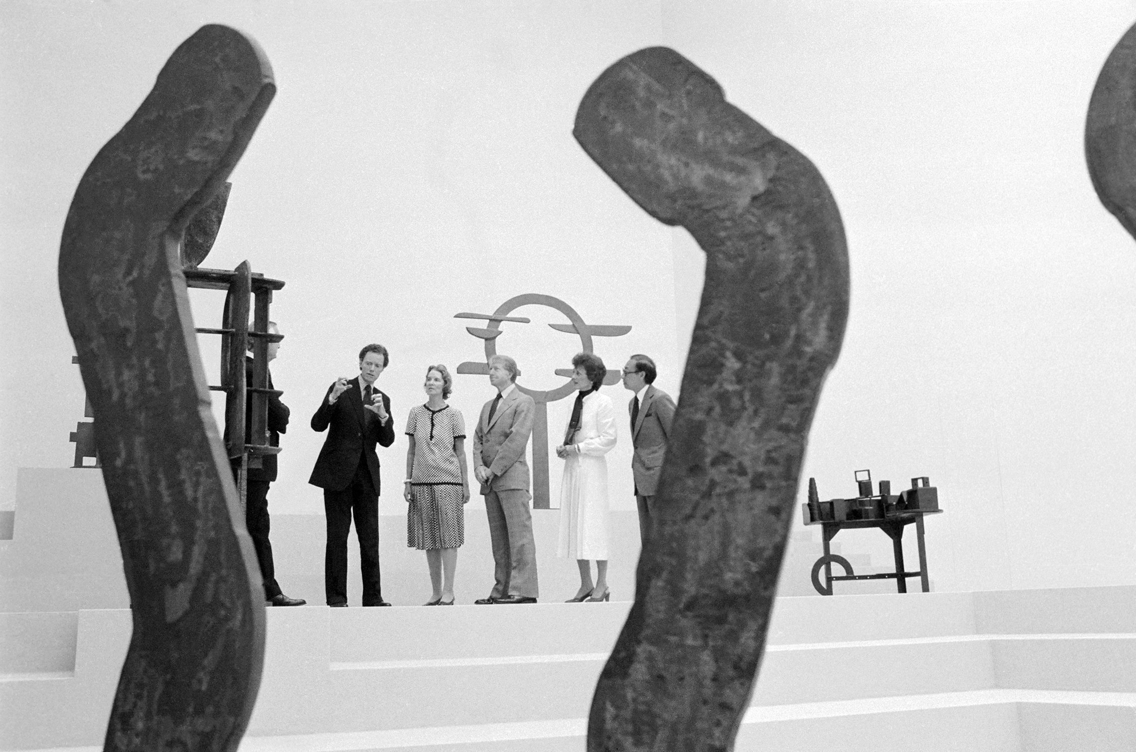 June 2, 1978: President Carter accepted for the nation on June 1, the new East Wing of the National Gallery of Art. Framed by a piece of sculpture, left to right are: Paul Mellon (partially hidden), who donated the new wing; J. Carter Brown, director of the gallery; Mrs. Mellon; President Carter; Mrs. Joan Mondale, wife of the vice president; and Ieoh Ming Pei, the architect. (Getty)