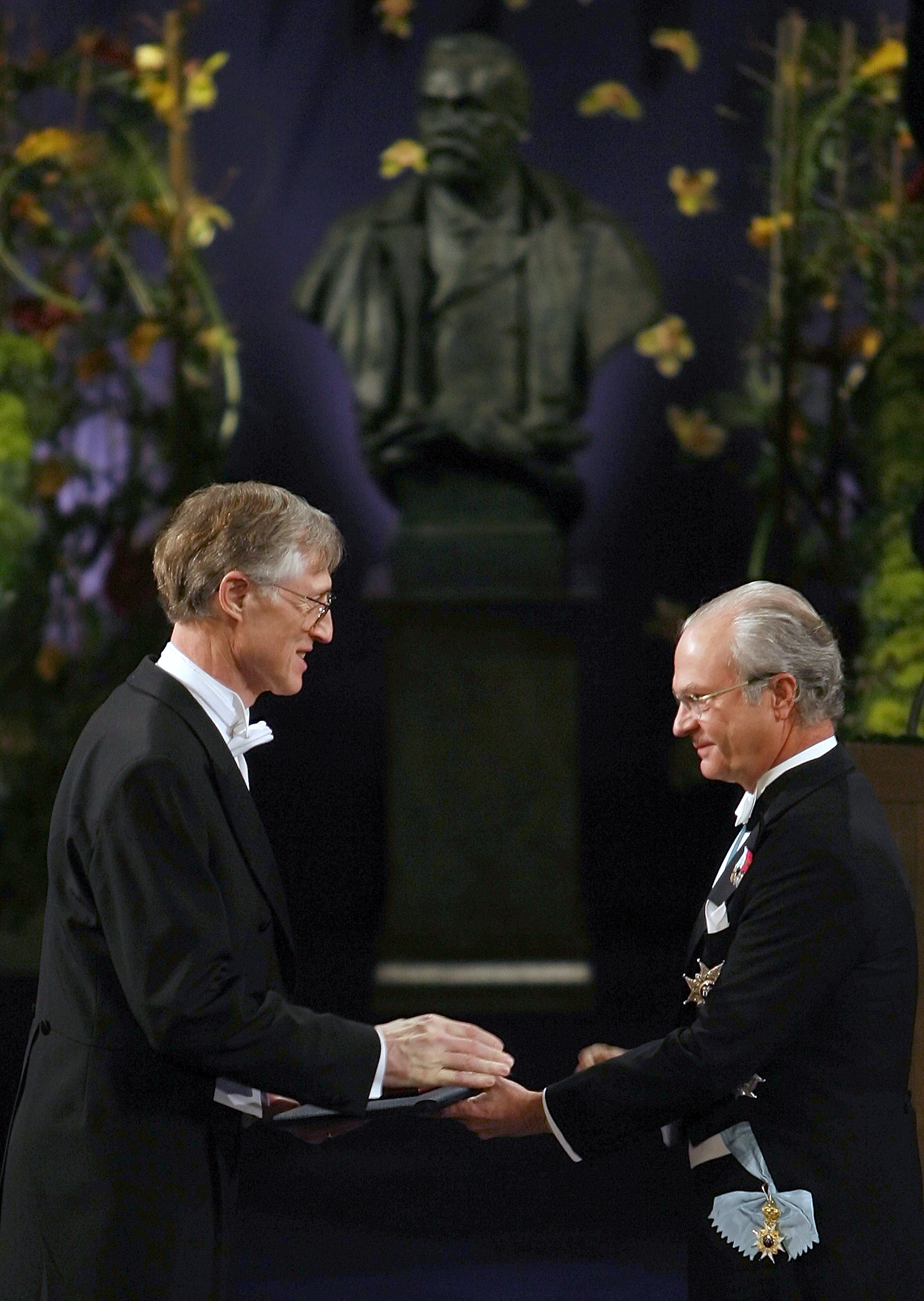 John Mather receives the 2006 Nobel Prize in Physics from King Carl Gustaf of Sweden at the Concert Hall in Stockholm. The Royal Swedish Academy of Sciences made the award jointly to Mather and his fellow scientist George Smoot III "for their discovery of the blackbody form and anisotropy of the cosmic microwave background radiation." (© BOB STRONG/Reuters/ CORBIS)
