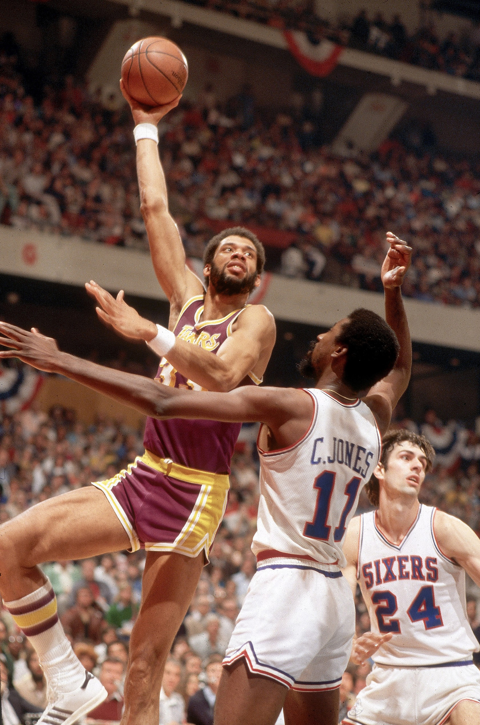 Kareem Abdul-Jabbar shoots over the head of the Philadelphia 76ers' Caldwell Jones in the 1980 NBA finals. (Manny Millan/Sports Illustrated)